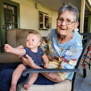 Woman who uses ECG products holding grandchild.